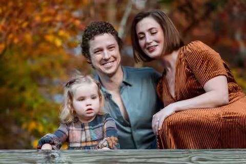 Family portrait in fall leaves, photographed by GKeyPhoto